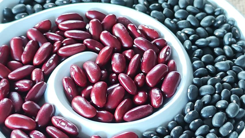 Red beans and black beans on a plate.