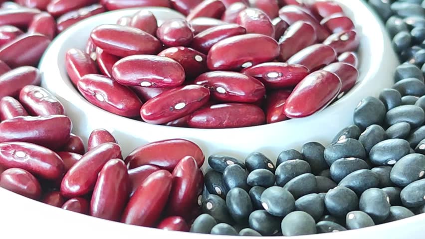 Red beans and black beans on a plate.