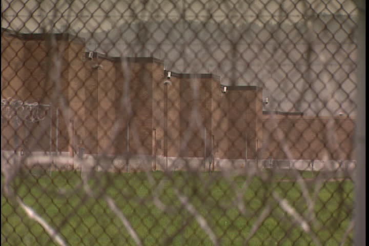 Brick buildings seen through chain link fence at Southern Ohio Correctional Facility in Lucasville, Ohio.