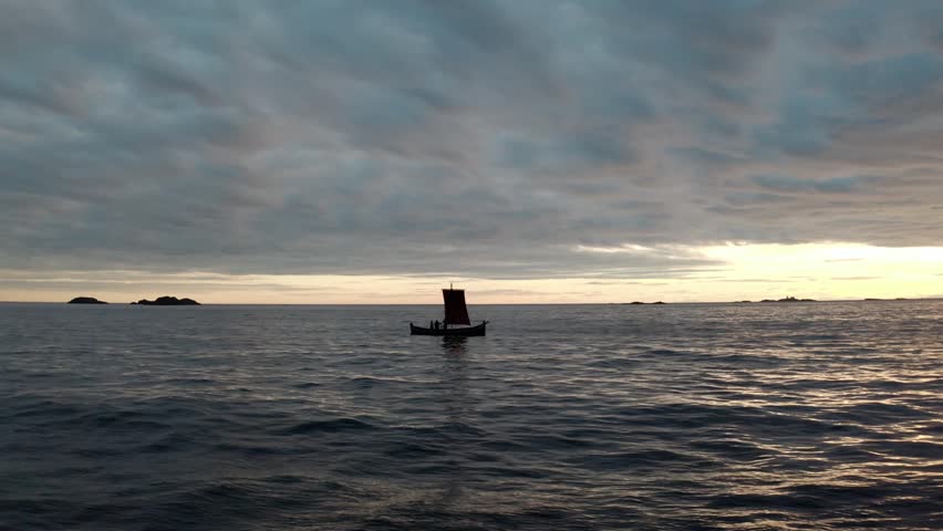 A Viking longship floats still on a calm ocean as the camera moves closer, revealing three figures aboard beneath a cloudy sky with sunlight breaking through on the right.