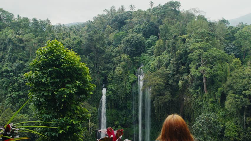 Woman watching sekumpul waterfall in bali