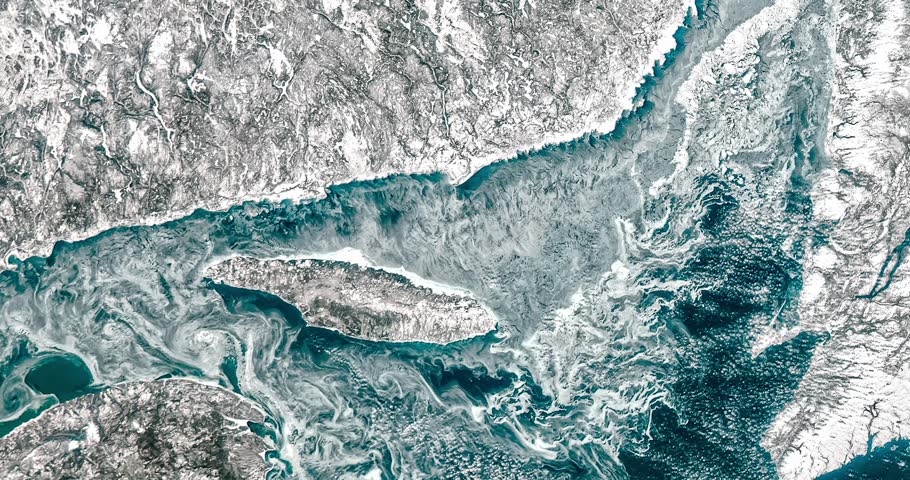 Aerial shot of north bay near snowy land. Camera is moving forward and left. Animation based on image by NASA