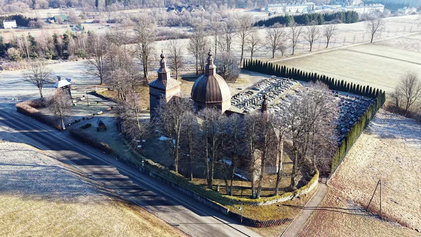 Scenic rural church with fresh green fields and trees
