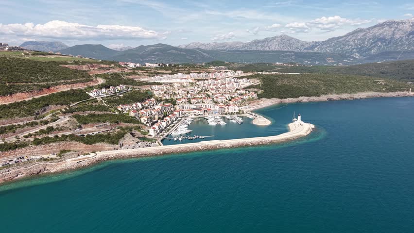Aerial View of Lustica Bay, Montenegro. Luxury Apartment Buildings and Marina, Drone Shot