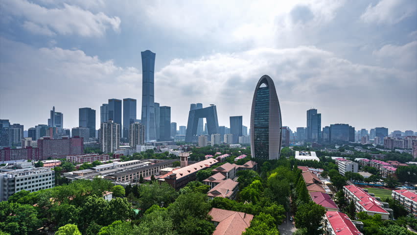Modern urban landscape of Beijing, China: CBD skyscrapers, blue sky and white clouds.