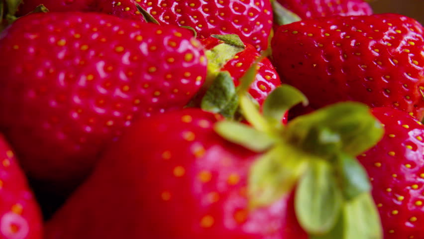 Cinematic macro shot of fresh organic berries. Defocused background, soft daylight bokeh. Visualizes summer morning, sweet snack, vitamins, clean eating, freshness.