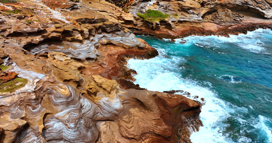Spectacular rock formations created by the power of water and wind. Rocky shore of Hawaii, USA.