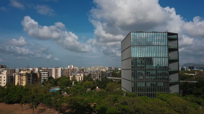 A mesmerising time-lapse of fast-moving clouds drifting across a bright summer sky over the Mumbai skyline.