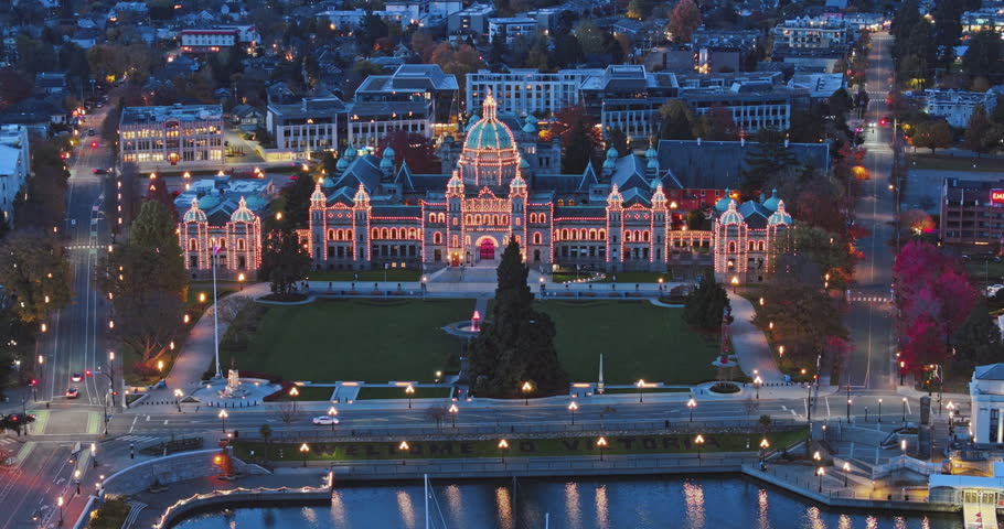 Aerial view of BC Legislative Parliament Building near harbor at night in Victoria, British Columbia, Canada