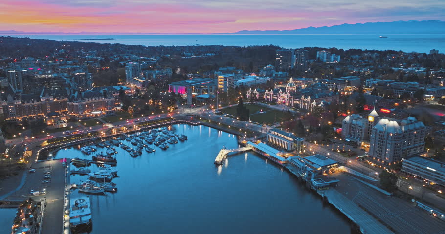 Aerial view of BC Legislative Parliament Building near harbor at night in Victoria, British Columbia, Canada