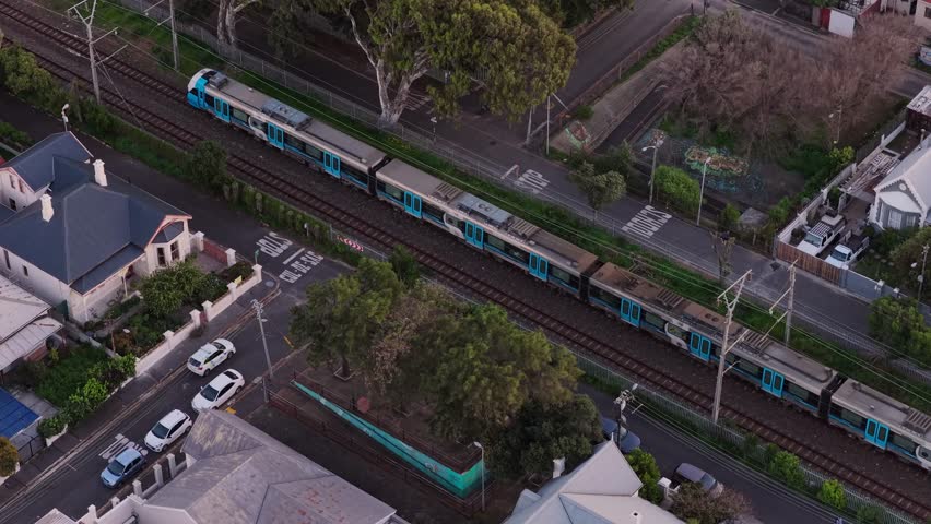 Train running through suburb in Cape Town, South Africa