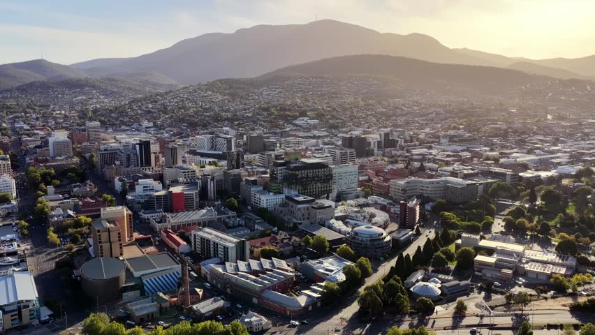 Mt Wellington over Hobart city to Tasman bridge on Derwent river – aerial panorama in Tasmania.