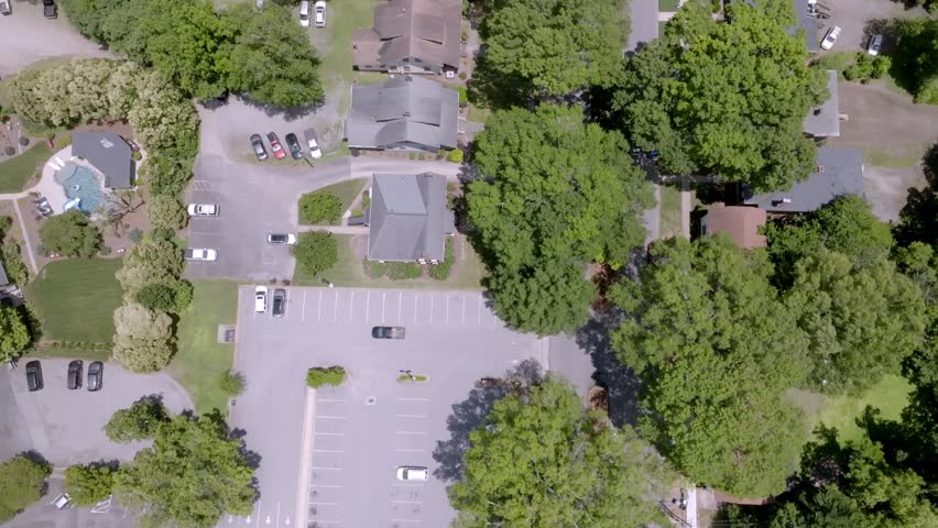 Neighborhood homes in Statesville, North Carolina with drone video moving overhead.