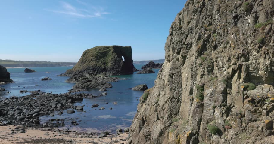 Elephant rock surrounded by a beautiful white sand coastline in Northern Ireland