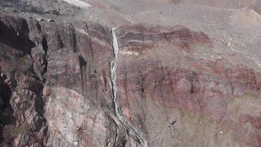 Caucasus, North Ossetia. Adaykom Gorge. Mountain waterfall.