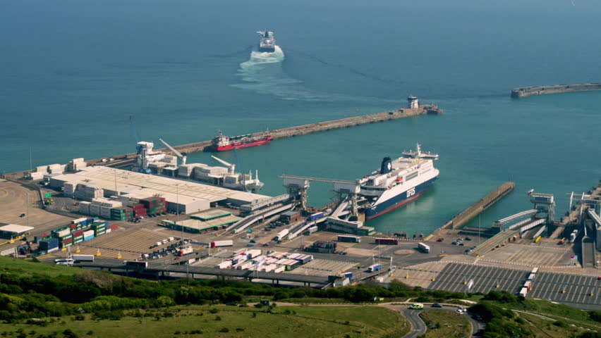 Aerial view of a ferry leaving the Port of Dover, with trucks and cars waiting for boarding