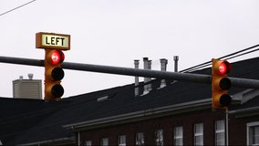 Traffic Lights in Action. Double traffic lights directing traffic in rush hour. House in background. - Powered by Shutterstock - Get 15% off with code: PIKWIZARD15
