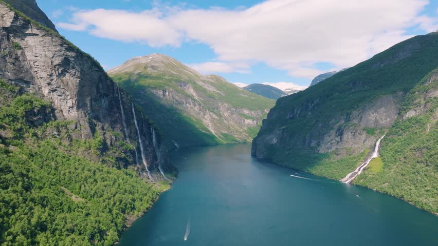 Seven Sisters Waterfall, Geiranger Fjord, Norway. Nature in fjords. Traveling through the Norwegian fjords. Scandinavia. View of nature from the drone. Vacation and travel in summer Norway.
