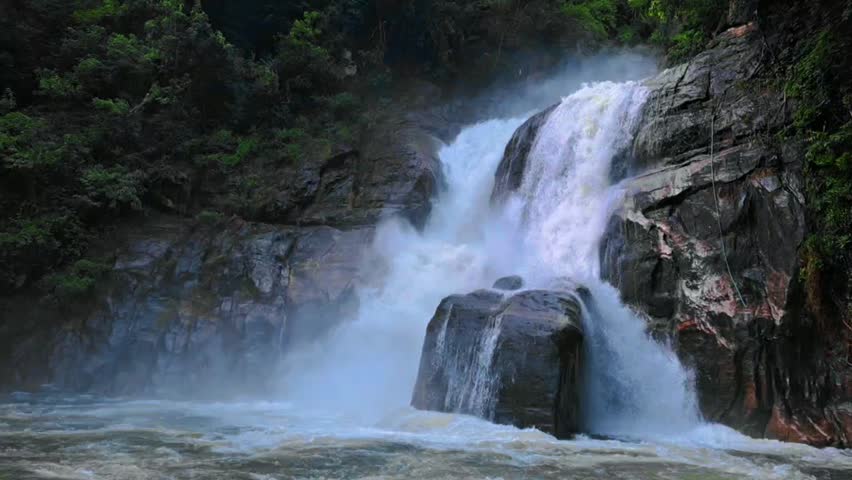 A beautiful waterfall flowing between rocks