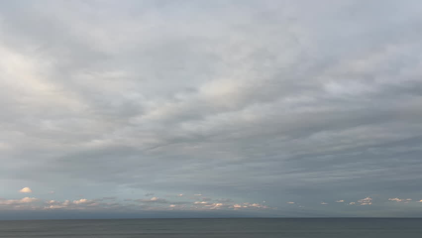 Calm Horizon Beneath an Expansive Cloudy Sky