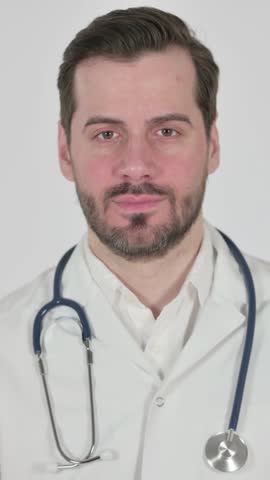 Portrait of Doctor showing Thumbs Up Sign , White Screen, Vertical Video