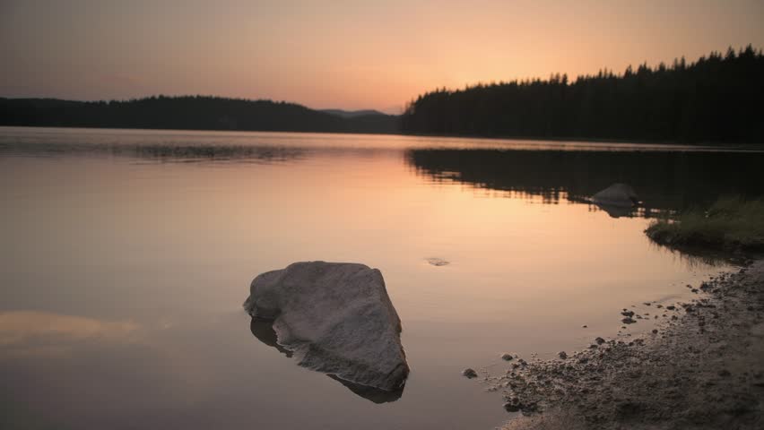 Beautiful sunset over Shiroka polyana dam (Wide meadow), Rodopi mountain, Bulgaria.