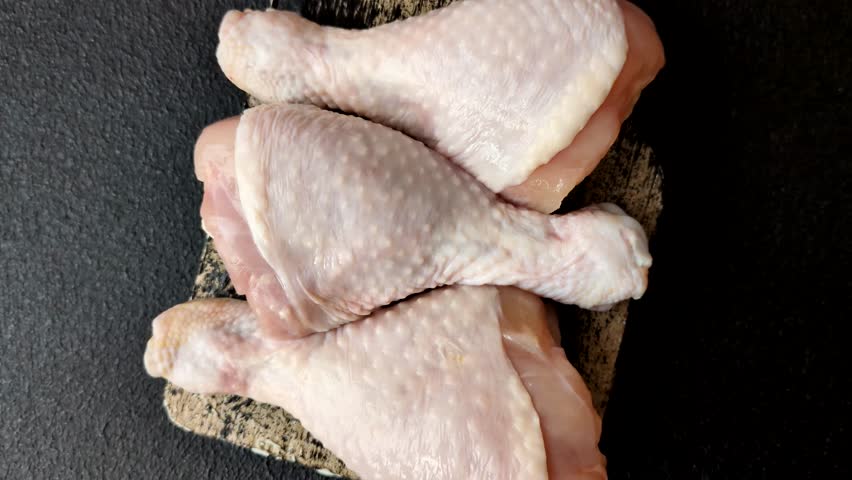 Raw chicken legs, poultry meat for grilling or barbecue. Chicken legs as a food backdrop for your design