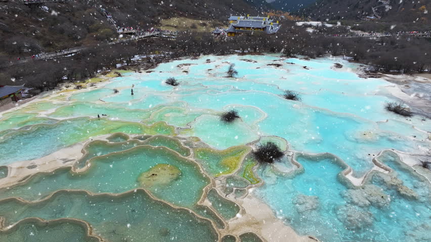 Aerial view of falling snow in Huanglong National Park, China.