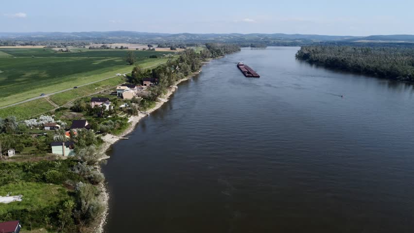 Aerial view of hurricane damaged forest near river in Serbia, fallen trees and environmental destruction. g.