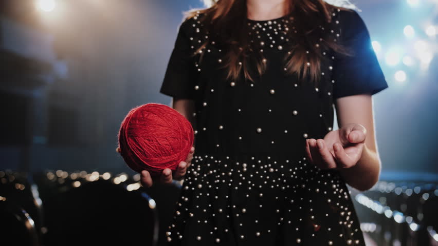 Woman Holding Red Yarn Ball as Thread of Fate Metaphor