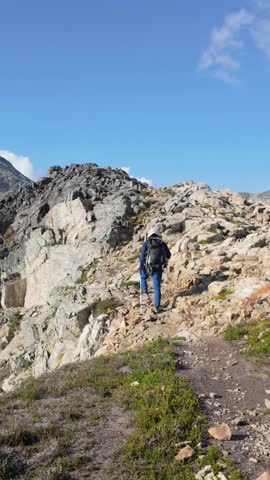 Hiker Ascending Rocky Mountain Path in British Columbia, Canada