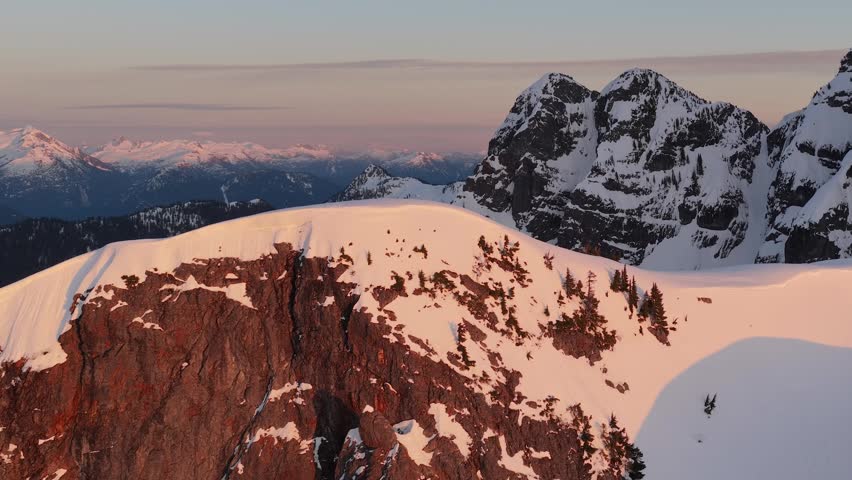 Stunning Golden Hour Over Snow-Capped Mountains in British Columbia, Canada