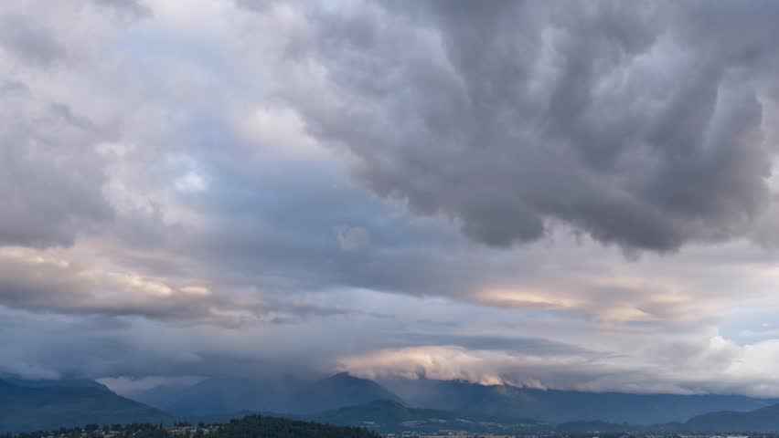 Dramatic Sky Over Majestic Mountains and Valley in British Columbia, Canada at Dusk