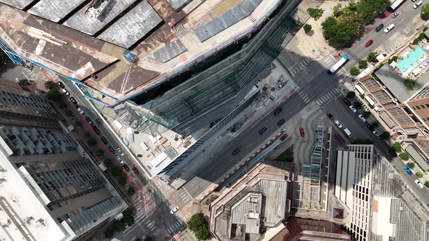 Aerial descent down the side of a skyscraper