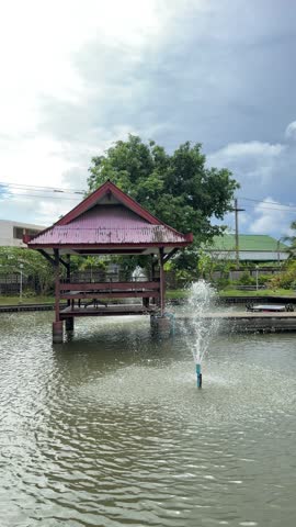 Small hut and simple fountain. 