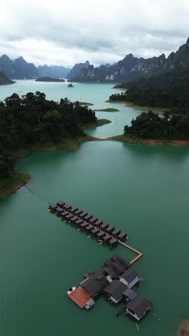 High angle drone shot of floating resort on Cheow Lan Lake