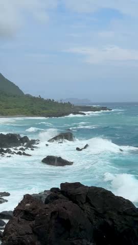 Waves keep colliding with the seashore.