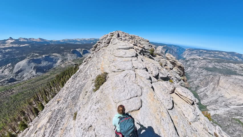 High Angle View of Couple Hiking Across Clouds Rest in Yosemite
