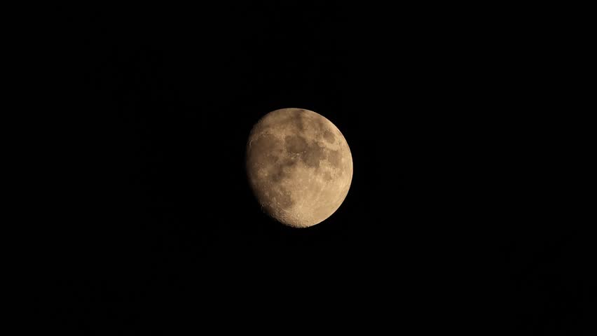 full moon disappears among the clouds