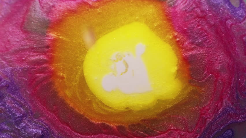 Mix paint spilling. Splash color. Defocused white orange purple foam ink in water particles waves on abstract art acrylic background.