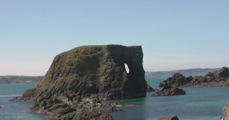 wide-angle shot of Elephant Rock with tropical ocean water surrounding during summer