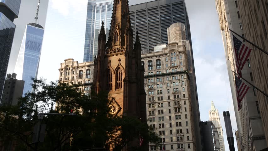 New York City Manhattan Downtown Financial District, United States of America. World Trade Center skyscraper, FiDi tower building. Modern business center, Trinity church 1846 from Broadway. Religion.