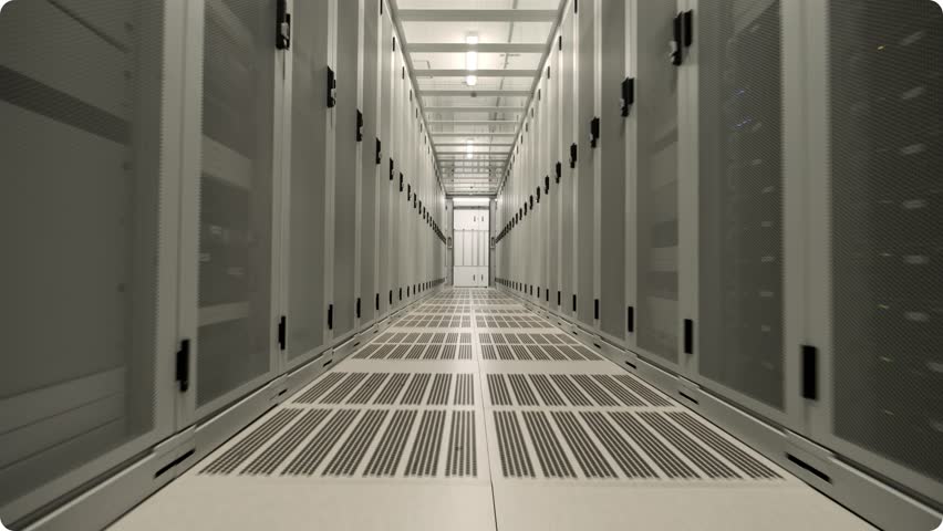 A slow forward dolly shot through a modern data center hallway.