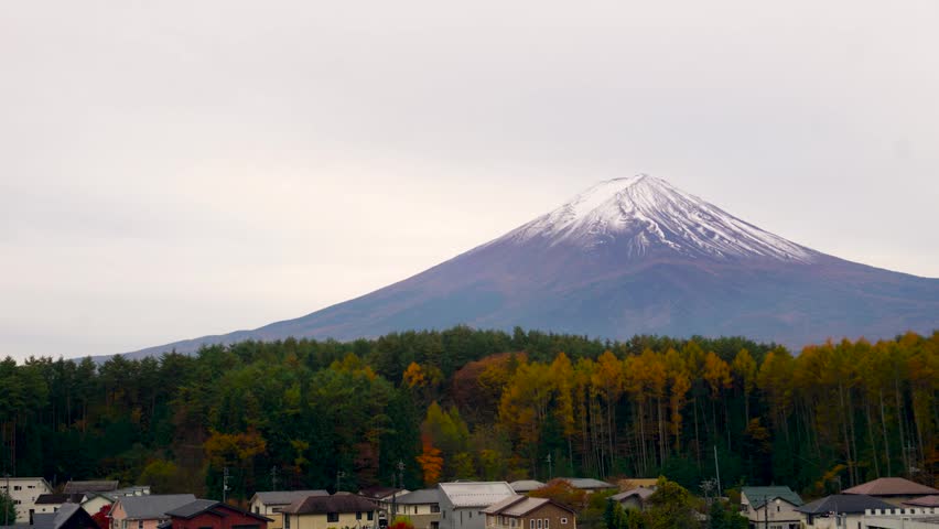 Beautiful time-lapse landscape of Mount Fuji with moving clouds.