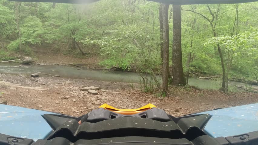 creekside parking an OHV, side by side in the Ozarks on a scenic spring-fed creek in Arkansas