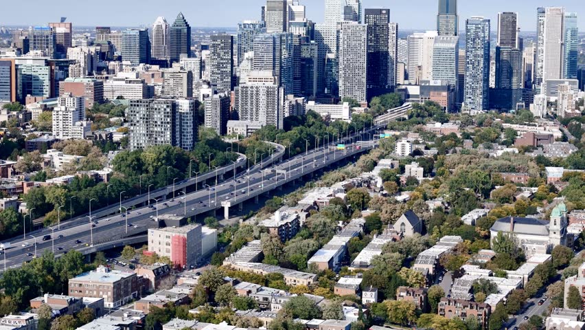Aerial view of Montreal downtown skyline with Autoroute 720 and modern skyscrapers, Quebec, Canada. g.