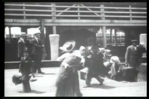1900s - Immigrants arrive at Ellis Island, New York, in 1903.
