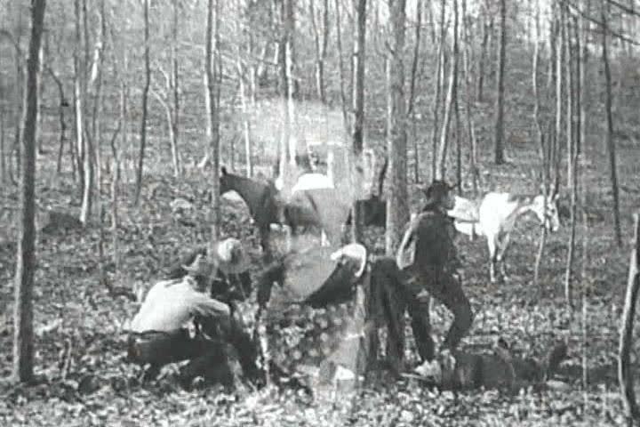 1900s - A cowboy fires a gun directly at the camera.