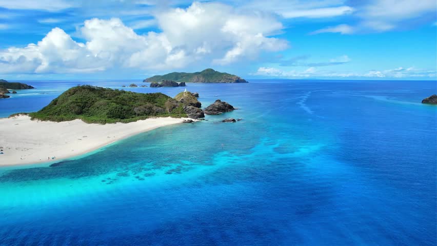 Drone View of Tropical Coastline and Coral Waters Around Gahi Island
Aerial footage of the stunning tropical coastline and transparent blue waters surrounding Gahi Island near Zamami Island, Okinawa, Japan.