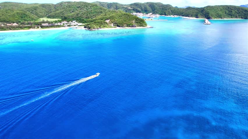 Drone View of Tropical Coastline and Coral Waters Around Gahi Island
Aerial footage of the stunning tropical coastline and transparent blue waters surrounding Gahi Island near Zamami Island, Okinawa, Japan.